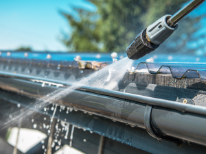 Professional gutter maintenance service on a Larkspur home, ensuring seamless gutter efficiency.