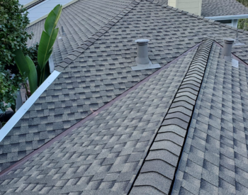 Newly installed asphalt shingle roof on a Ross home