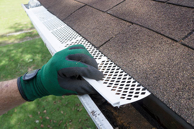 gutter guard being installed