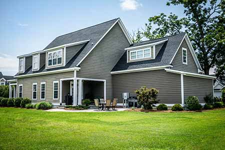 two story house with asphalt roof